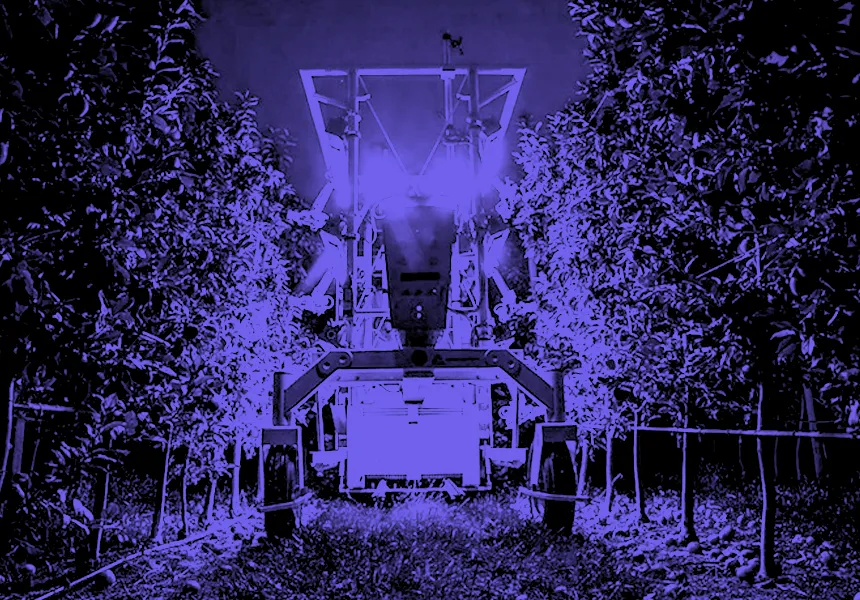 Image of Advanced Farm Technologies' robotic fruit picking solution at work in an orchard.
